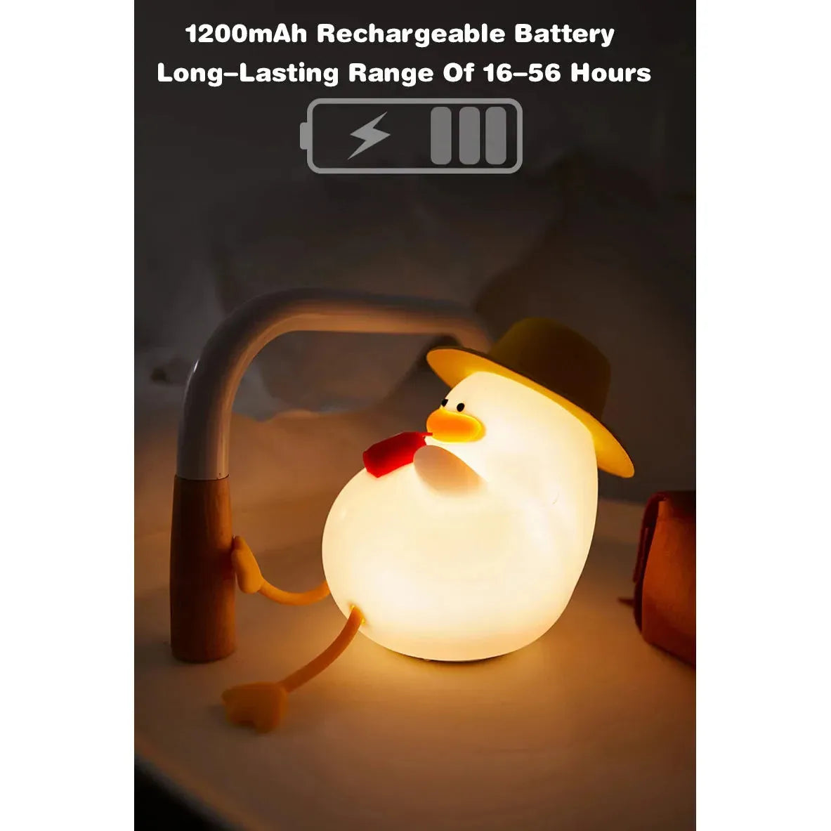 The Cute Cartoon Duck Rechargeable LED Night Light, a silicone bedside lamp for kids’ room decor, features a duck with a hat and glasses on a curved stand. Its 1200mAh rechargeable battery provides portable lighting with a warm glow lasting 16 to 56 hours, making it an ideal birthday gift.