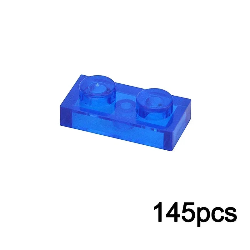 A single 1x2 transparent blue brick from the MOC Transparent Bulk Brick Set, compatible with Lego, is displayed on a white background; 145pcs appears in black at the bottom right.