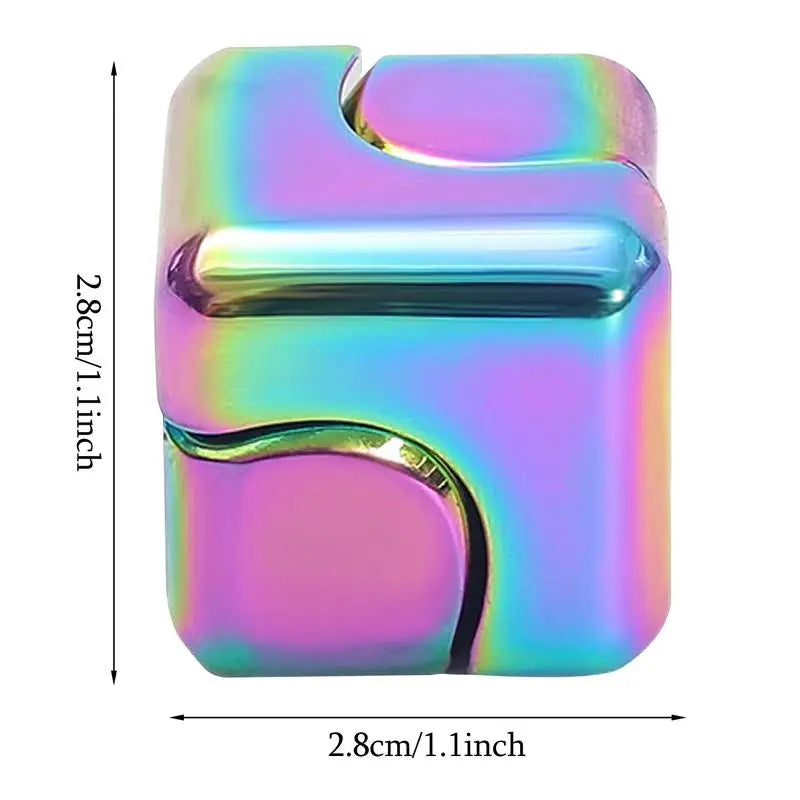 The Infinity Gear Cube Spinner is a small, metallic, iridescent antistress fidget block with rounded edges and curved grooves (2.8 cm per side), suitable for ages 14+. Its rainbow surface reflects light beautifully. Made in Mainland China.