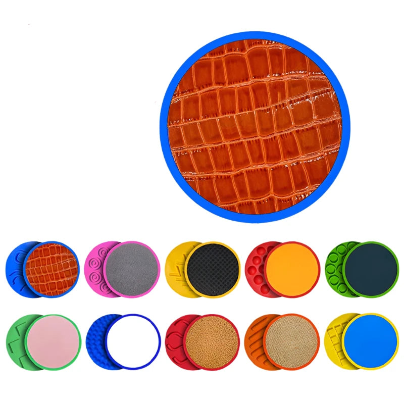 The Montessori Tactile Adventure Mat with Balance Stones features colorful circular objects in orange, blue, green, yellow, and pink. Each stone has a unique texture like crocodile skin or ripples, making it ideal for sensory play and developmental balance activities.