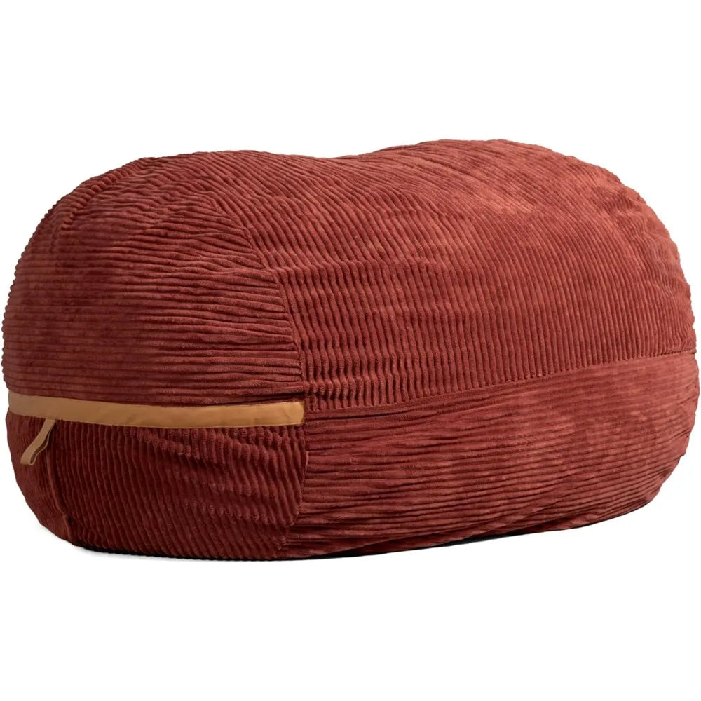 The Fuf XXL Foam Filled Bean Bag Chair in Deep Terracotta features a 6-foot oval shape, plush corded fabric, and a tan zipper along one side.