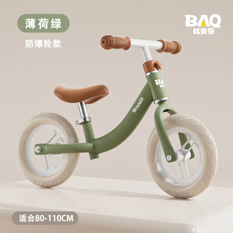 A Magnesium Alloy Toddler Balance Bike featuring a small, green design with 12-inch beige wheels and brown handlebars is set against a neutral backdrop. The text in Chinese characters states its suitability for children 80-110 cm tall.