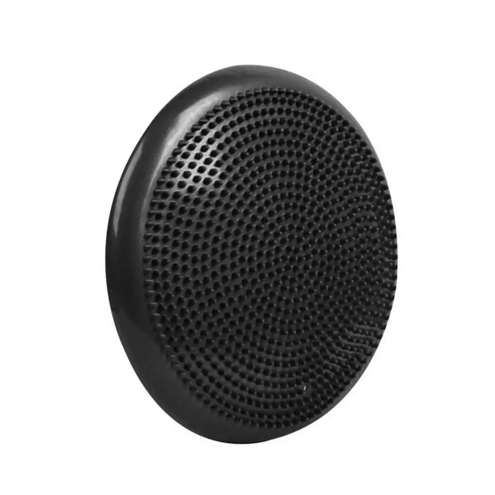 A black circular speaker grille with a perforated surface, akin to a non-slip balance training mats air cushion disc, is set on a white background. Its smooth edge and textured pattern reflect the core strength and harmony emphasized in sensory integration and yoga.