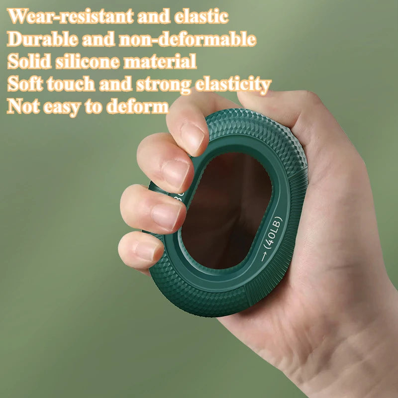 A hand holds a green Silicone Grip Trainer Ring, marked 40 LB, with a blurred background emphasizing its durable, wear-resistant design. Made from solid silicone for wrist rehab and hand strengthening, it offers a soft touch and strong elasticity to boost grip strength without deformation.