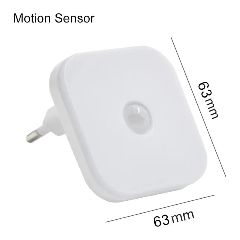 The Dimmable Motion Sensor LED Night Light with an EU plug is a white, square-shaped wireless lighting solution with rounded edges. Its 63mm by 63mm and energy-efficient, ideal for dimmable cabinet lighting in a babys room, bedroom, or corridor.