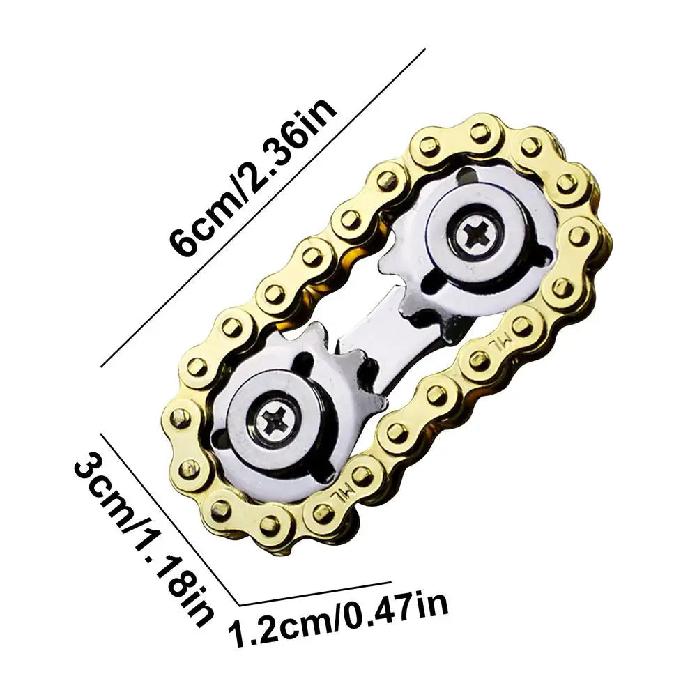 The Sprockets Flywheel Fingertip Gyro Fidget Spinner in gold resembles a bike chain with metal accents and two central rotating gears. Its dimensions are 6cm long, 3cm wide, and 1.2cm thick—perfect for dropshipping enthusiasts looking for unique items.