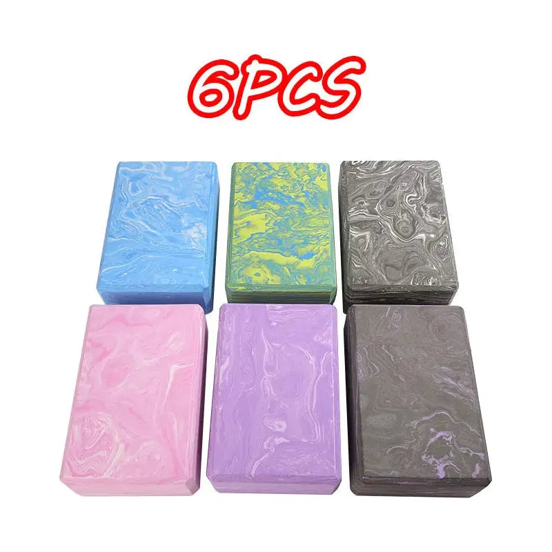 Six Montessori Sensory Integration Training Balance Stones are arranged in two rows with marbled designs in blue, green, black, pink, purple, and gray. Ideal for tactile play and educational use. 6PCS is displayed above in bold red letters.