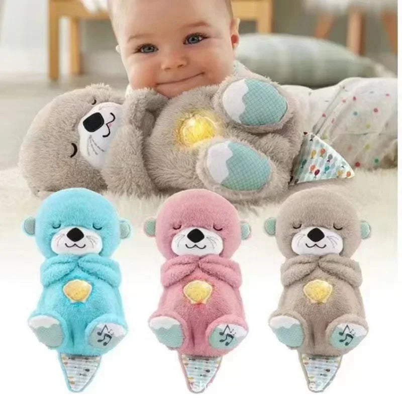 A newborn rests on a colorful striped blanket, hugging a plush bear with an illuminated heart. Nearby are three musical stuffed toys including the Soothing Breathing Otter Musical Plush Toy in blue, pink, and gray; all feature glowing hearts with musical notes, creating a serene atmosphere.