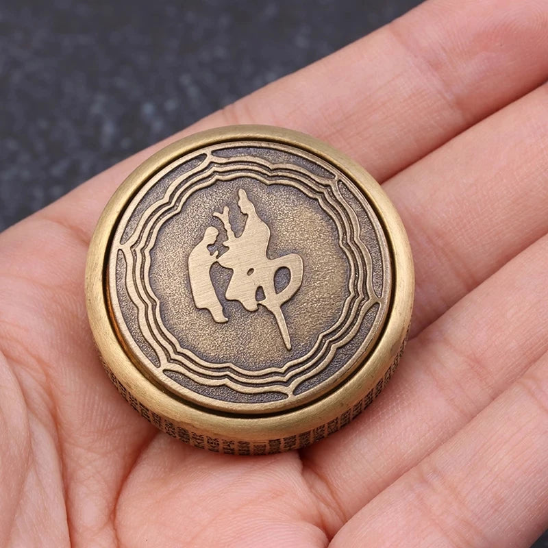 The Zen Buddha Fidget Spinner Metal EDC Toy for Adults, shown in color 1pcs with engraved Buddha designs and textured edges, rests on an open palm and helps relieve stress and anxiety.