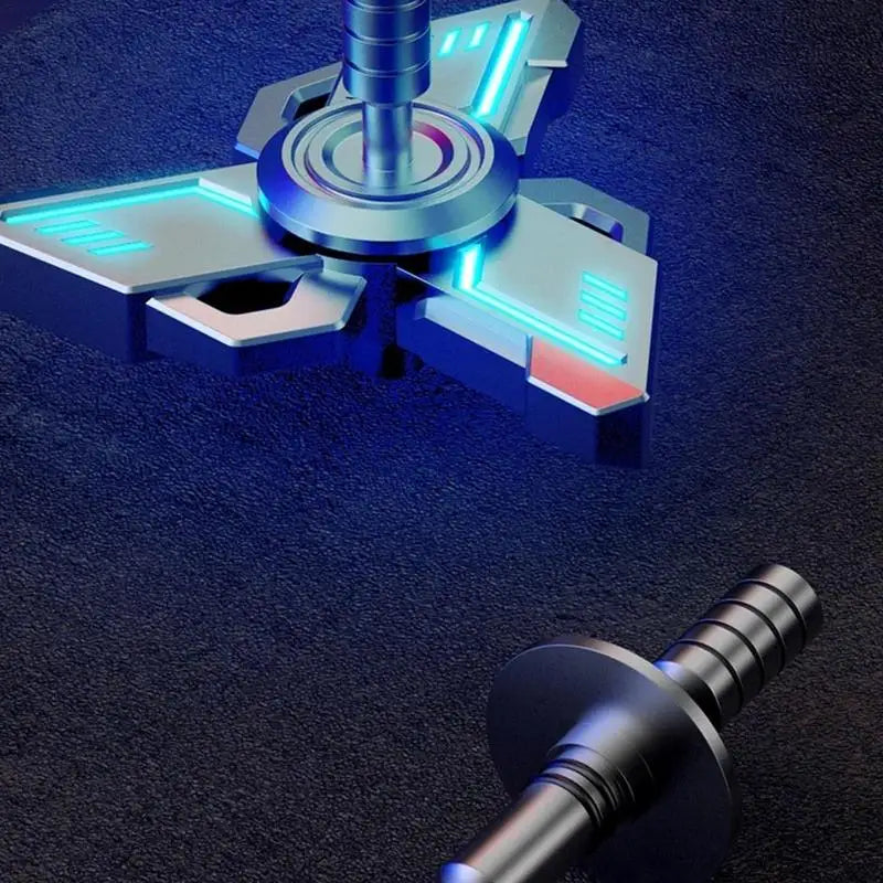 A futuristic metal spinner gyroscope toy with glowing blue and red accents rests on a dark surface. Its intricate triangular design resembles a sci-fi gadget. Nearby lies another part, possibly the stand—an accessory for the Spinner Gyroscope Toy Children Spinner Fidget Toy.