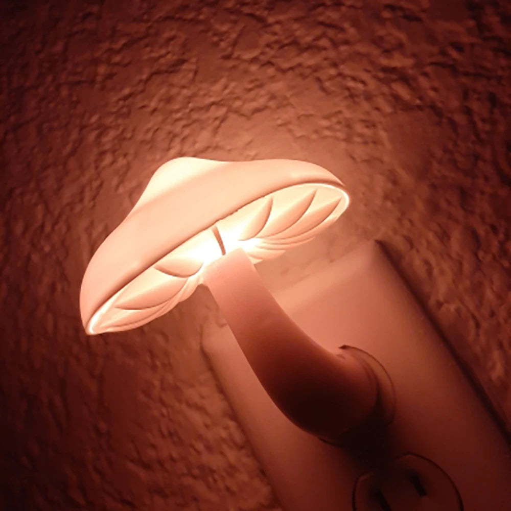The Mushroom LED Night Light with Sensor Control, in warm white and designed for EU/US plugs, softly illuminates a textured wall with its ambient glow when plugged into an electrical outlet.