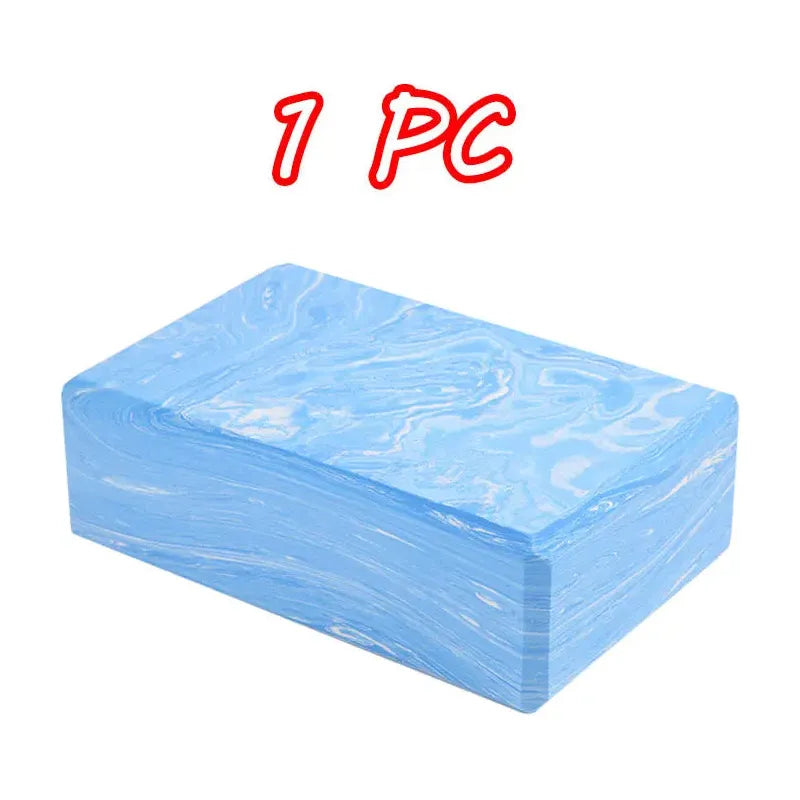 A light blue rectangular foam yoga block featuring a marbled pattern is set against a white background, akin to Montessori Sensory Balance Stones for Outdoor Play and Integration Activities. The text 1 PC appears in bold red above the block.