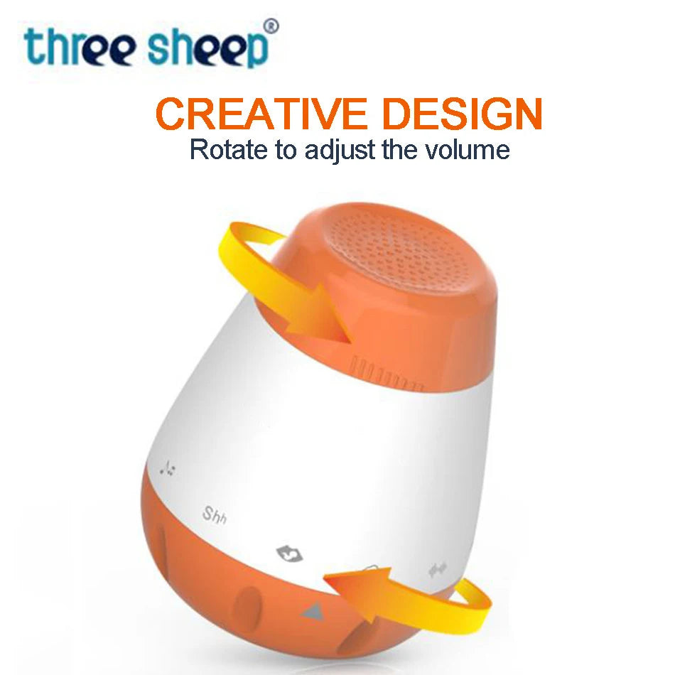 The Smart Baby Sleep Helper is a white and orange speaker labeled three sheep, ideal for sound therapy. It features volume-adjusting arrows and the phrases CREATIVE DESIGN and Rotate to adjust the volume, making it perfect as a white noise machine for infants.