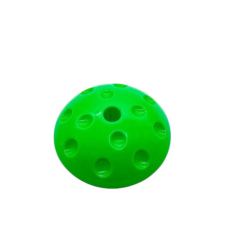 A Montessori-Inspired Kids Balance Stepping Stone, bright green with circular indentations and a central hole, resembling an inverted half-sphere on a white background, ideal for sensory integration to enhance motor skills in children.