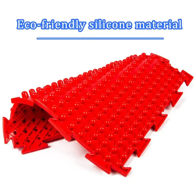 Folded, the Montessori Sensory Integration Training Balance Stones for Kids features a red silicone massage mat with textured bumps. The blue text above says Eco-friendly silicone material, ideal for sensory play and integration to enhance early learning and physical coordination.