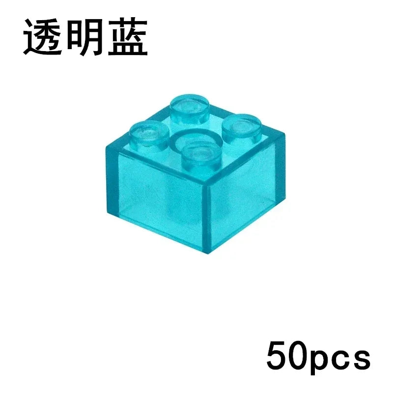 A clear blue 2x2 brick from the MOC Transparent Bulk Brick Set, compatible with Lego, is shown—perfect for expanding your building block collection.