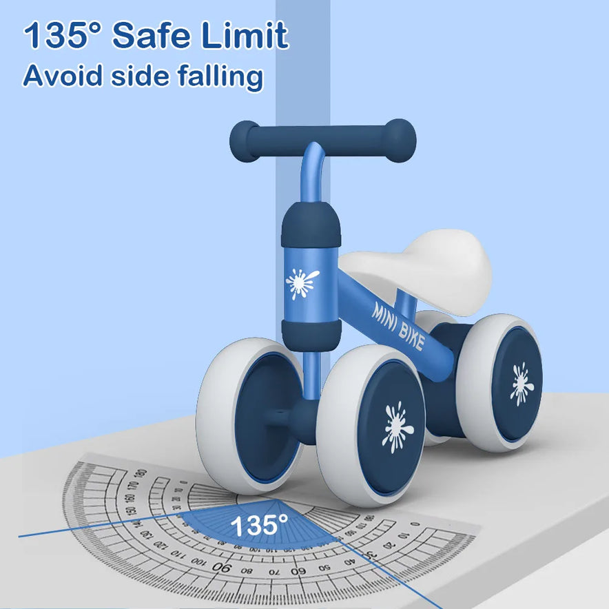 A blue and white Baby Balance Bike Ride On Toy for 1 Year Old Boys and Girls is shown tilted at 135° on a protractor, with text 135° Safe Limit and Avoid side falling, showcasing its stable, anti-drop design for toddlers aged 10-24 months.