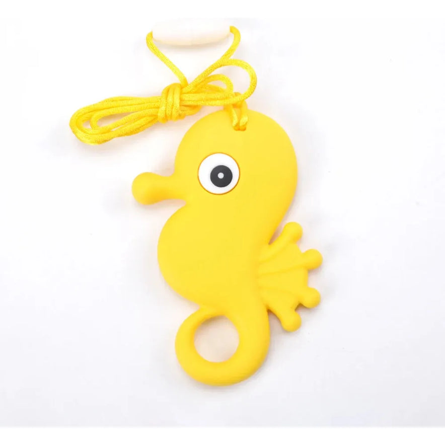 The Silicone Chewable Necklace for Kids is a yellow, seahorse-shaped teether with a handy cord, large cartoon-style eye, and small fin. Perfect for infants oral motor therapy and suitable for sensory needs like autism and ADHD.