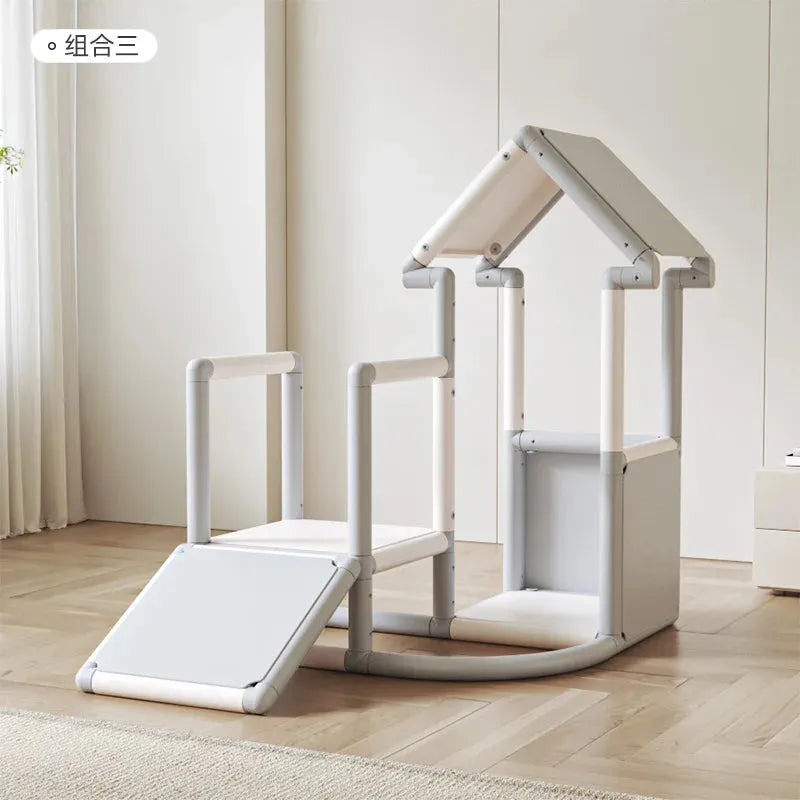 The Indoor Climbing Adventure Set for Kids is a minimalist play structure with a baby slide, two chairs, and a slanted roof house design. Its designed in neutral colors on a wooden floor in a bright room, ideal for childrens indoor climbing activities.