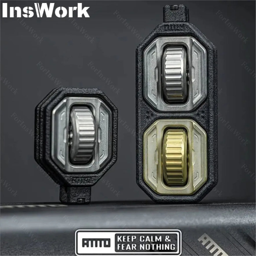 Two black and metallic rotary switches—one double, one single—with textured knobs stand upright. A sticker below reads AMMO KEEP CALM & FEAR NOTHING, identifying this as the Ammo Cracker Unzip Roller Fidget Toy Stress Relief Slider EDC Tool. InsWork watermark visible.