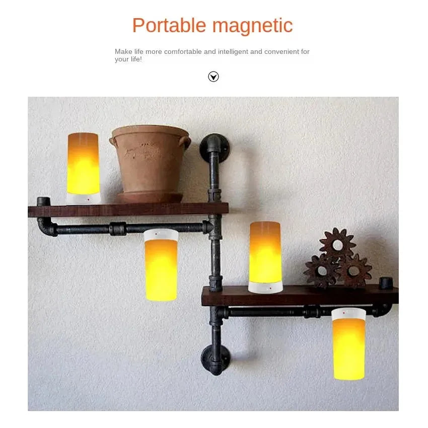 A wall-mounted shelf with black metal pipes and wooden planks displays a potted plant and gears. Four Simulated Flame LED Night Lights emit a warm yellow glow, simulating real flames. These portable, magnetic lamps promise versatile usage throughout your home.