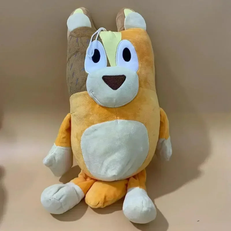 A 17cm 28cm 40cm Bluey and Bingo Family Plush Toy (mother) cartoon dog with orange and cream fur sits against a beige background—perfect as a soft gift for birthdays or Christmas.