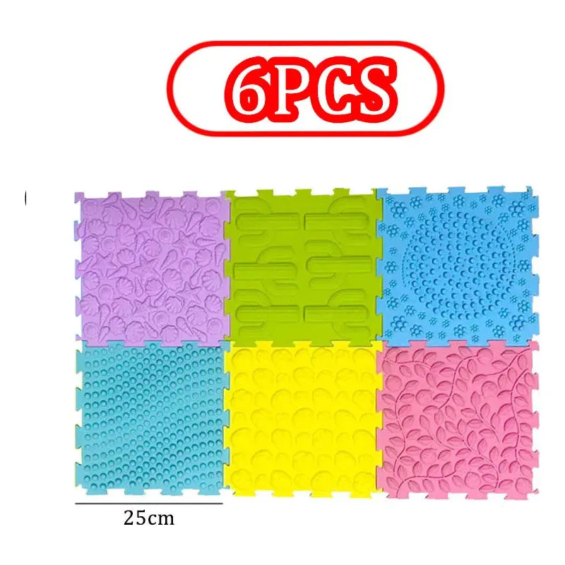 The Montessori Sensory Integration Training Balance Stones for kids is a set of six colorful interlocking foam tiles, perfect for sensory play. Each tile measures 25cm and features unique textures and colors—purple, green, blue, yellow, and pink—ideal for sensory integration activities.