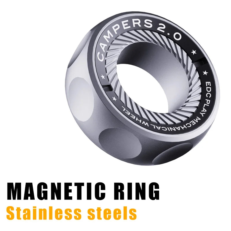 A silver Spystar Mechanic Ring Fidget Spinner features a patterned edge and magnetic metal design—an ideal anti-stress toy for adults. Bold text below reads: MAGNETIC RING Stainless Steel Office Desk EDC.