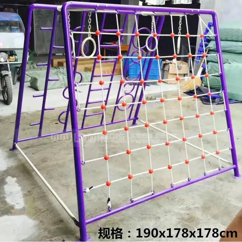 The Outdoor Steel Climbing Frame Swing for Childrens Sensory Integration Training features a purple metal structure with red and white rope netting, plus ladders and net sides. A tricycle in the background complements this colorful outdoor play equipment.