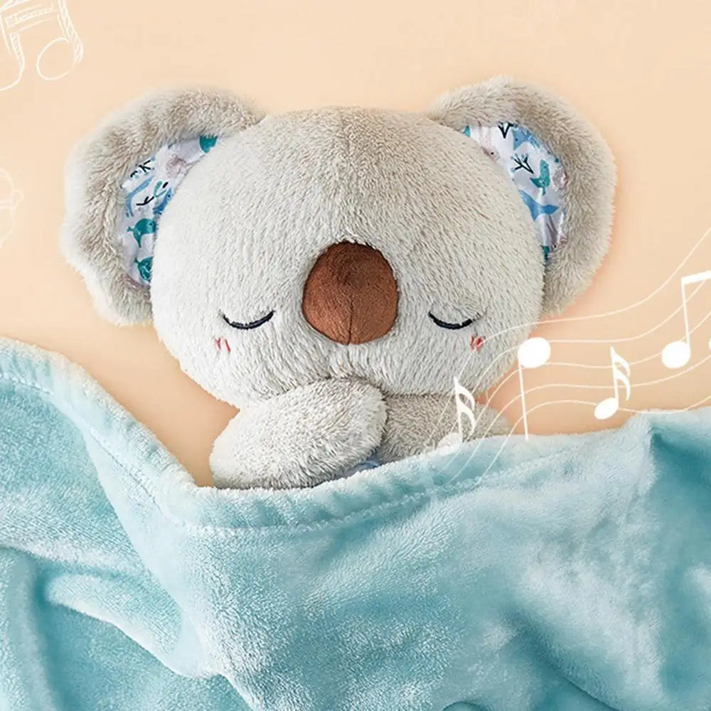 A plush koala toy with floral ears and a brown nose, nestled in a blue blanket, listens to calming melodies. Musical notes surround it against a light peach background. Ideal for newborn relaxation. Product: Koala Night Light Plush Toy – Musical Sensory Sleep Aid.