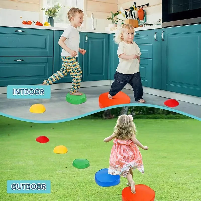 In a kitchen, two children enhance their motor skills by jumping on colorful Adventure Balance Stones. Meanwhile, another child in a dress plays on the green grass with the same stones. The text INDOOR and OUTDOOR emphasizes balance training opportunities in various settings.