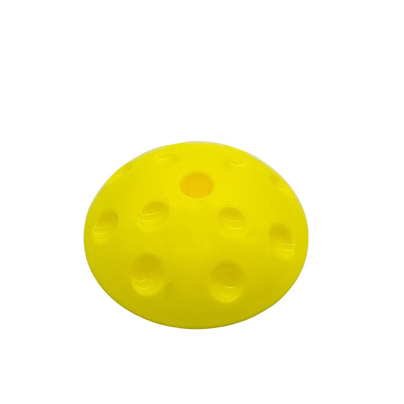 The Montessori-Inspired Kids Balance Stepping Stones is a yellow, dome-shaped item with circular indents, perfect for enhancing motor skills and sensory integration in children.