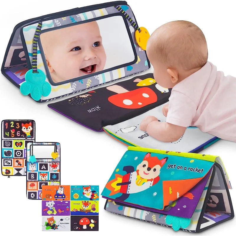 A baby lies on their stomach, exploring the Crinkle Cloth Book Visual Stimulation Newborn Toys 0-3 Months Brain Development Tummy Time Mirror Toy with colorful animal and rocket illustrations, interactive flaps for sensory exploration, plus pages with numbers and shapes.