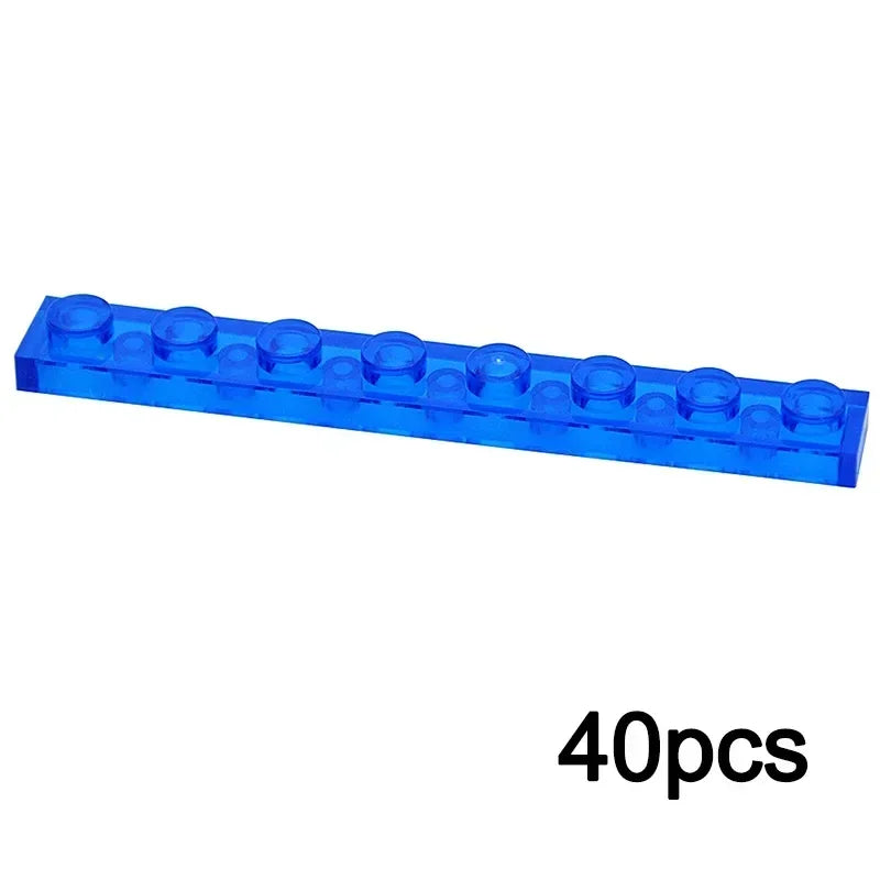 A single 1x8 transparent blue brick from the MOC Transparent Bulk Brick Set—compatible with Lego—is shown. “40pcs” at the bottom right highlights this bulk set, ideal for expanding your building block collection.