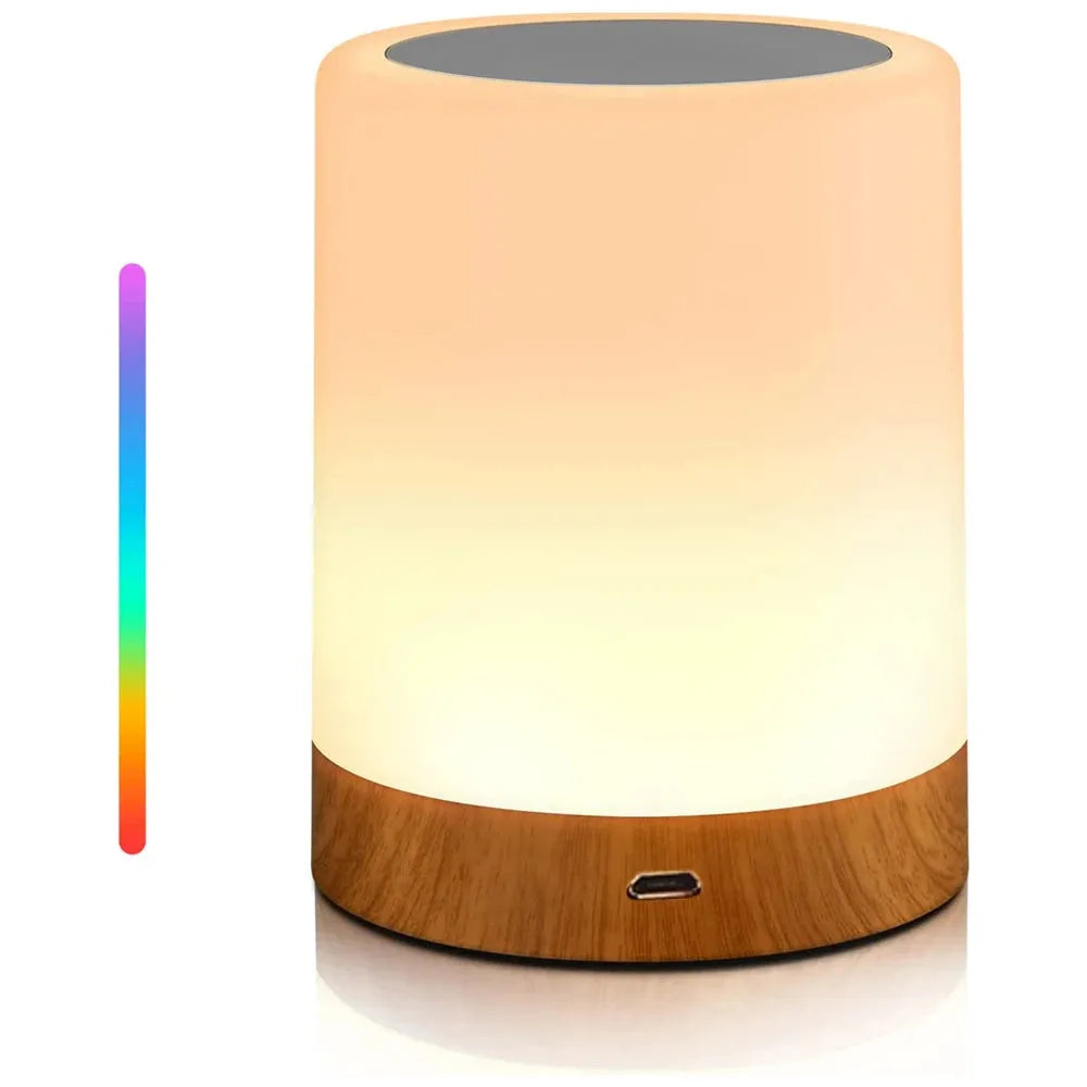 The Portable Touch-Sensitive LED Night Light, with a rechargeable battery, features a glowing white top and wooden base. It emits warm LED light and includes an RGB vertical color spectrum bar for customizable lighting options, ideal for kids rooms and gifts.