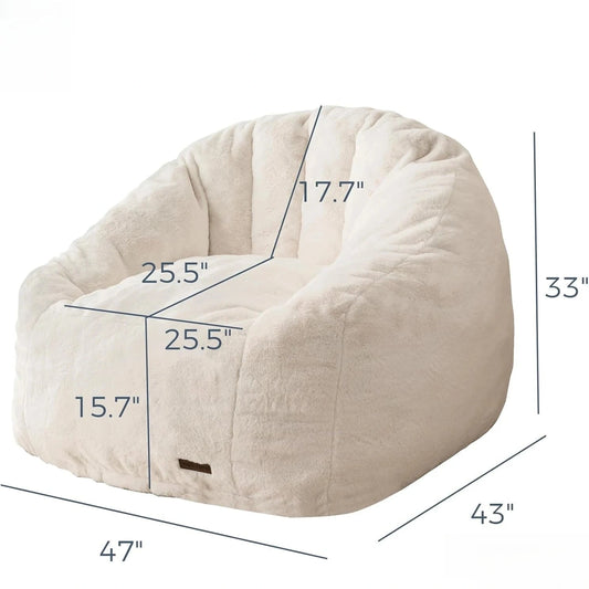 The Giant Bean Bag Chair is an oversized, cream faux fur shell-shaped seat (33H x 43D x 47W; seat: 25.5W x 25.5D x 15.7H; backrest: 17.7H), easy to assemble and made in the USA, perfect for adults and kids.