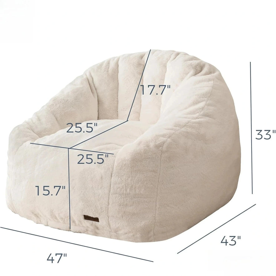 The Giant Bean Bag Chair is an oversized, cream faux fur shell-shaped seat (33H x 43D x 47W; seat: 25.5W x 25.5D x 15.7H; backrest: 17.7H), easy to assemble and made in the USA, perfect for adults and kids.