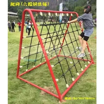 A child tackles the Outdoor Steel Climbing Frame Swing on a grassy field. Others enjoy the area, playing on this red and black, triangular net-like structure that supports sensory integration through physical activity.