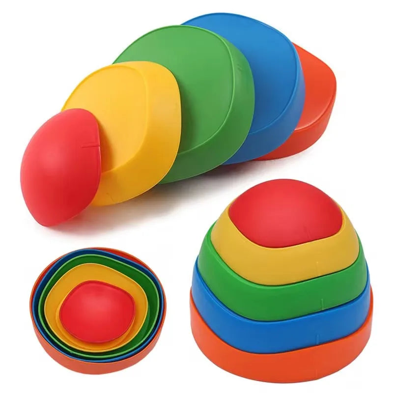 Discover Adventure Balance Stones: a tactile sensory stepping kit in vibrant red, yellow, green, blue, and orange. This set of five uniquely-sized stones enhances motor skills and offers a sensory balance experience with its multicolored stacking design for outdoor exploration and play.