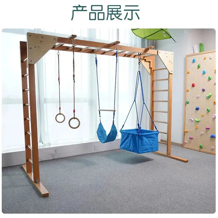 The Indoor Sensory Fitness Ladder for Kids features a childrens fitness ladder, climbing rings, a swing, and a blue hammock seat. It also includes a colorful climbing wall to enhance sensory integration training in a naturally lit carpeted room for an inviting play environment.