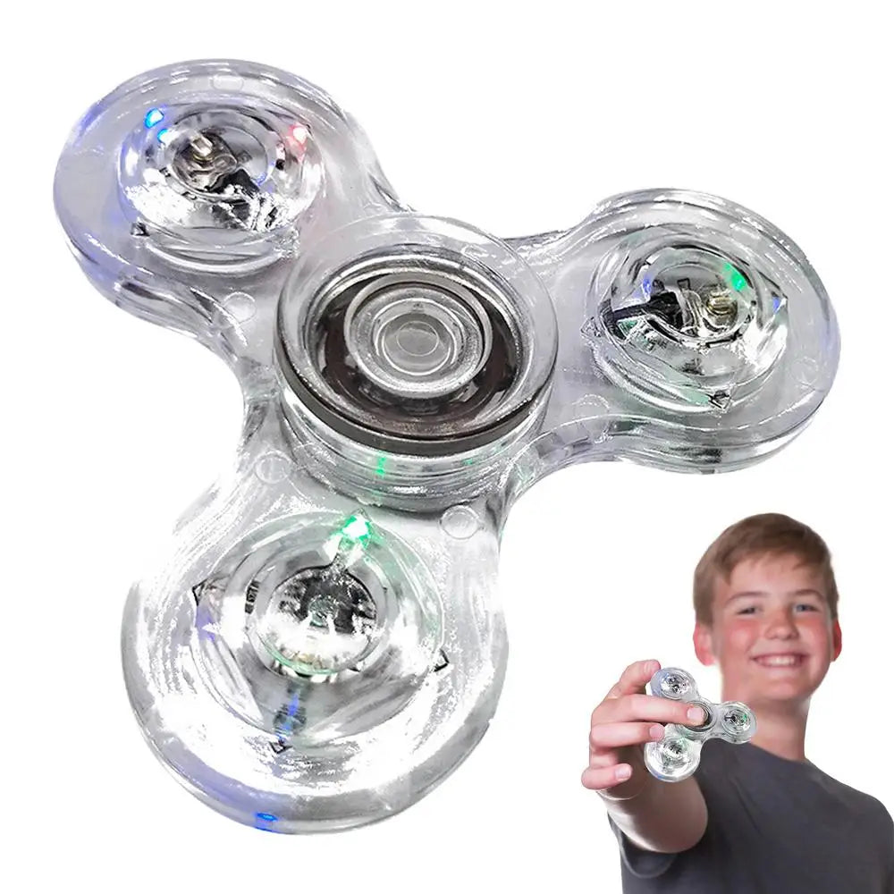 A young person happily holds a Crystal Finger Spinners Luminous LED Light Fidget Spinner, which glows brilliantly in the dark for stress relief against a white backdrop.
