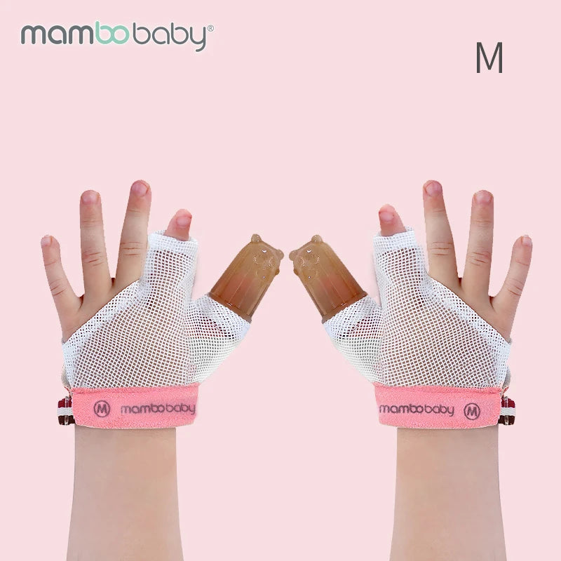 Two baby hands wearing Mambobaby Anti-Nail Biting Gloves with white mesh mittens and pink straps. Brown silicone giraffe-shaped thumb tips provide teething relief and discourage thumb sucking. A light pink background subtly displays M.