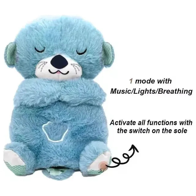 The Musical Breathing Otter Plush Toy features blue plush with closed eyes, offering music, lights, and calming breathing effects. Instructions on activating all features via the sole switch are clearly marked with an arrow for newborn comfort and sensory play.