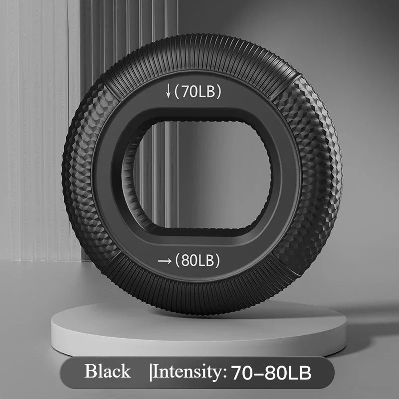 A black Silicone Grip Trainer Ring for Hand Strengthening and Wrist Rehabilitation is displayed on a stand with textured sides. 70LB and 80LB markings indicate varying resistance levels, enhancing grip strength. A minimalistic gray background emphasizes this sleek fitness device.