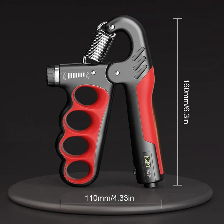 The Hand Gripper for Muscle Development and Fitness Workouts, featuring a robust metal spring on a black platform, is red and black with adjustable resistance. It includes measurement markings up to 100kg and measures 110mm/4.33in wide by 160mm/6.3in tall, ideal for strength exercises.