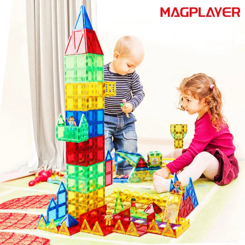 Two children immerse themselves in building a tall tower with the Magplayer Magnetic Tiles Construction Set for Creative Kids, a Montessori educational toy that enhances cognitive skills, while MAGPLAYER branding is displayed visibly.