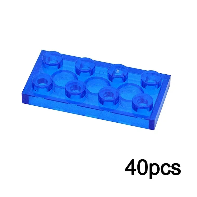 A 2x4 transparent blue plastic brick, compatible with Lego, from the MOC Transparent Bulk Brick Set—ideal for building block collections—displayed above the text 40pcs.