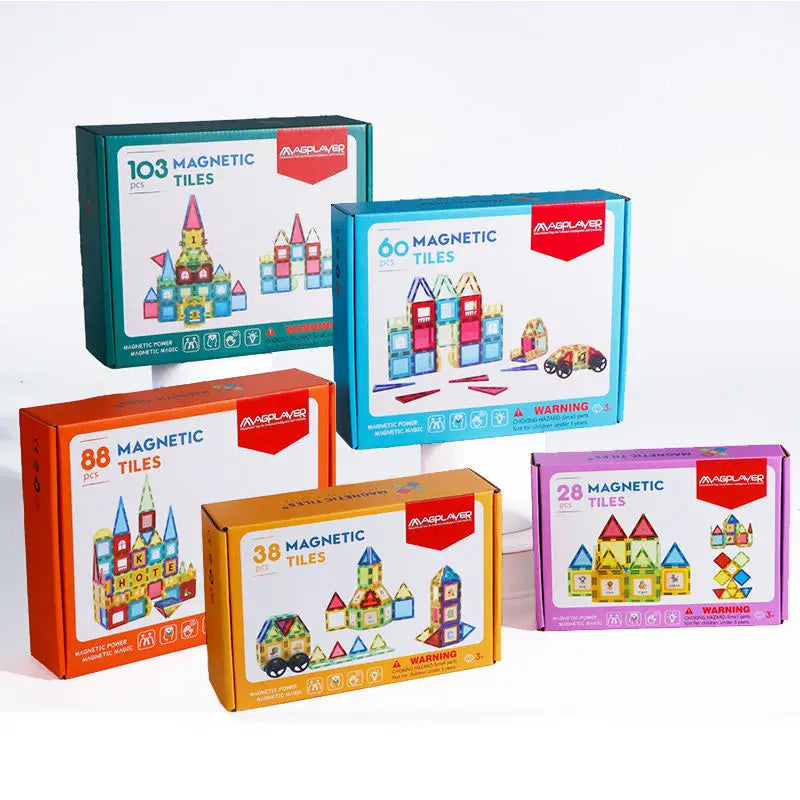 Five boxes of Magplayer Magnetic Tiles Construction Set for Creative Kids contain 103, 60, 88, 38, and 28 pieces. Each box showcases colorful geometric structure illustrations with a warning label. These Montessori Educational Building Blocks foster cognitive development through creative play.