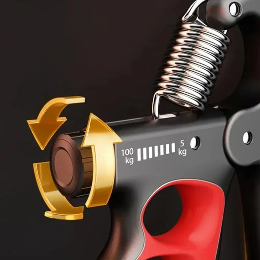 Close-up of the Hand Gripper for Muscle Development and Fitness Workouts with a black and red handle and metal tension spring. It has a dial adjustable from 5 kg to 100 kg with yellow arrows, making it an ideal grip strength trainer.