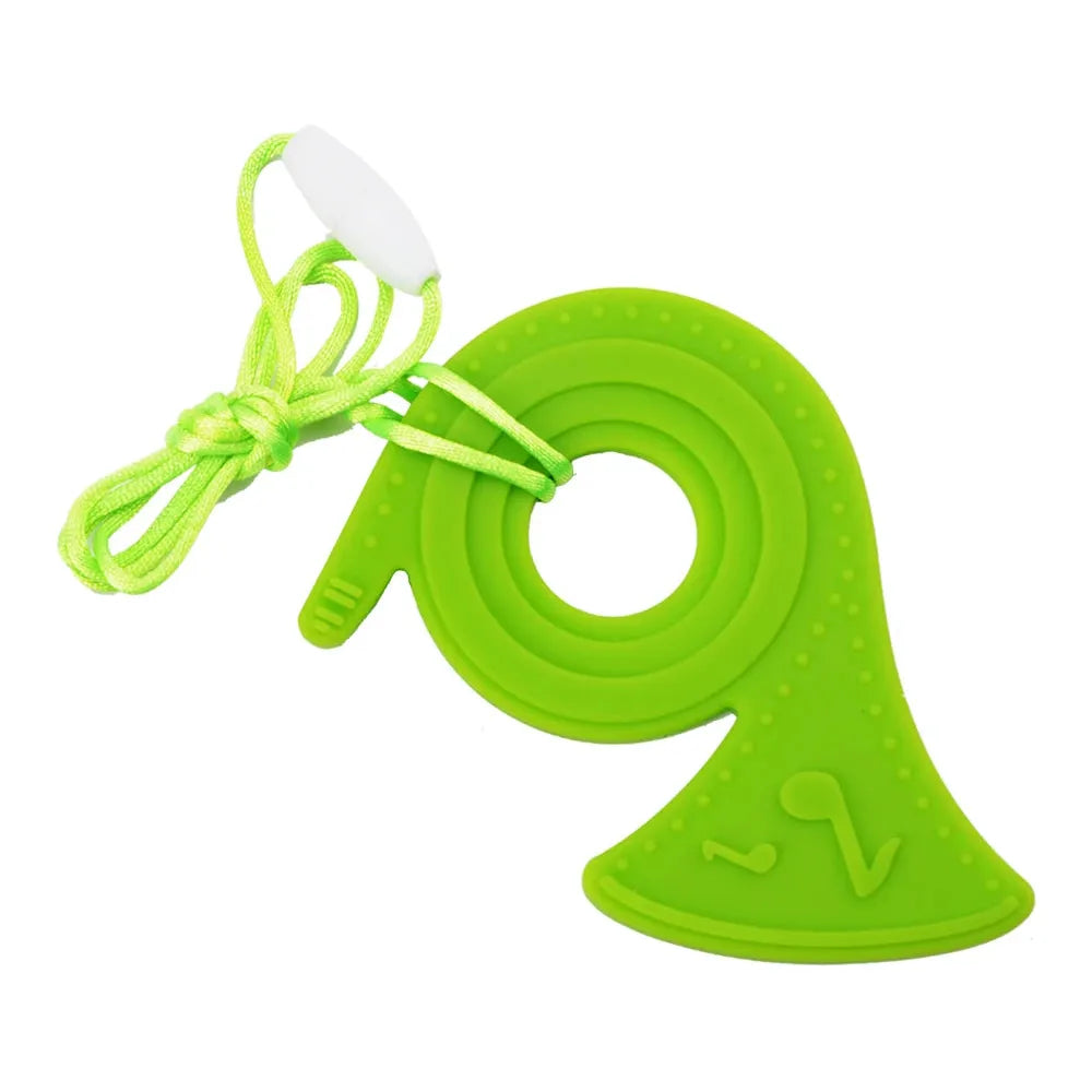 A duck-shaped, green silicone teether with textured dots and a central hole features a musical note design. Its attached to a green string with a white clip, offering oral motor therapy, as outlined in the Silicone Chewable Necklace for Kids - Sensory Teether Pendant for Autism and ADHD Therapeutic Use.